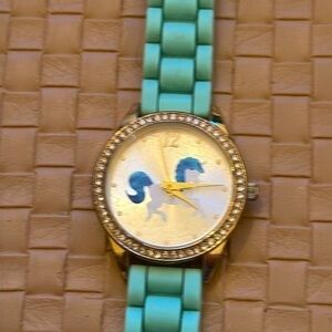 Justice gold tone unicorn quartz watch